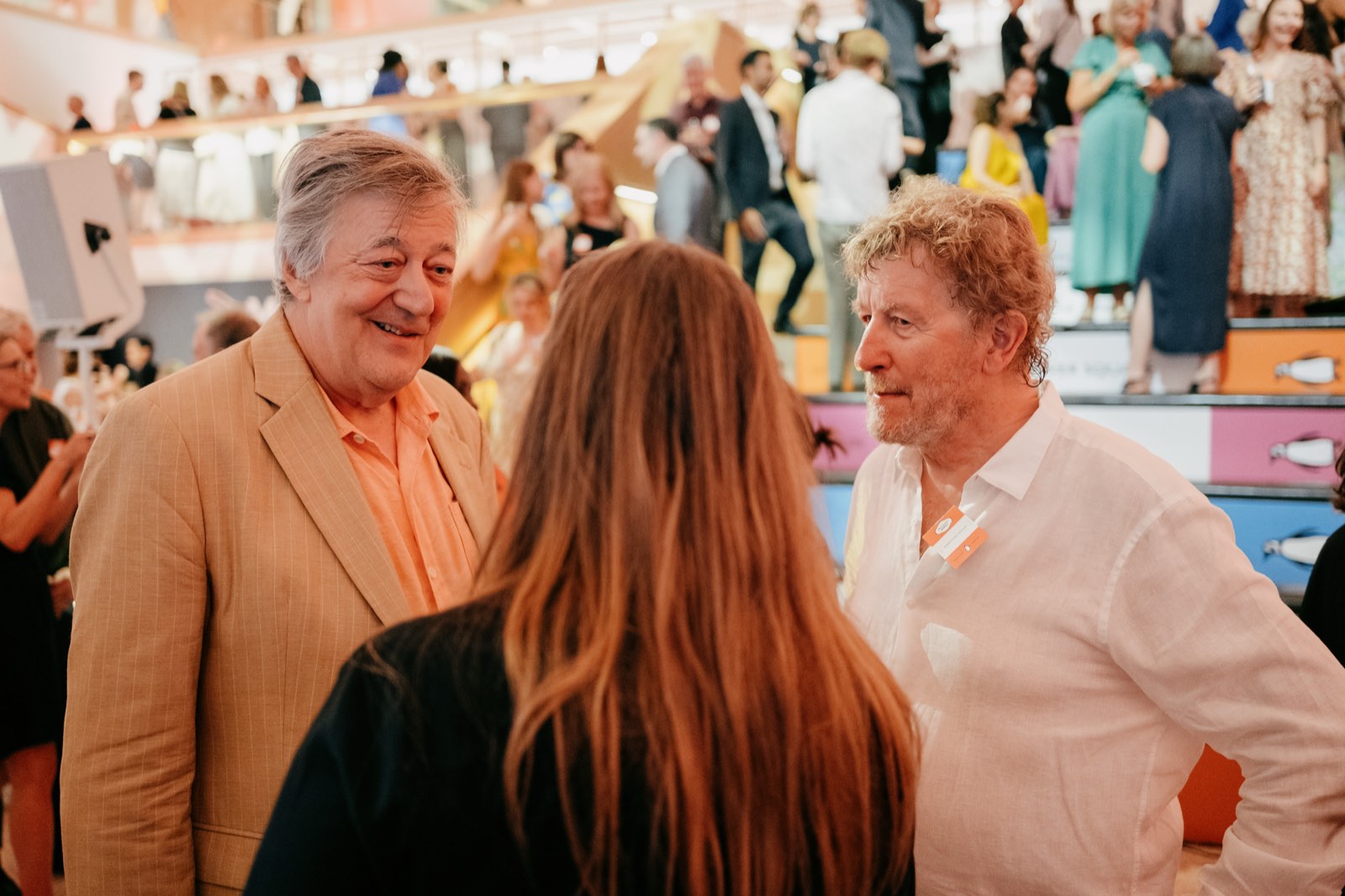 Guests talking during the Penguin 90th anniversary celebration