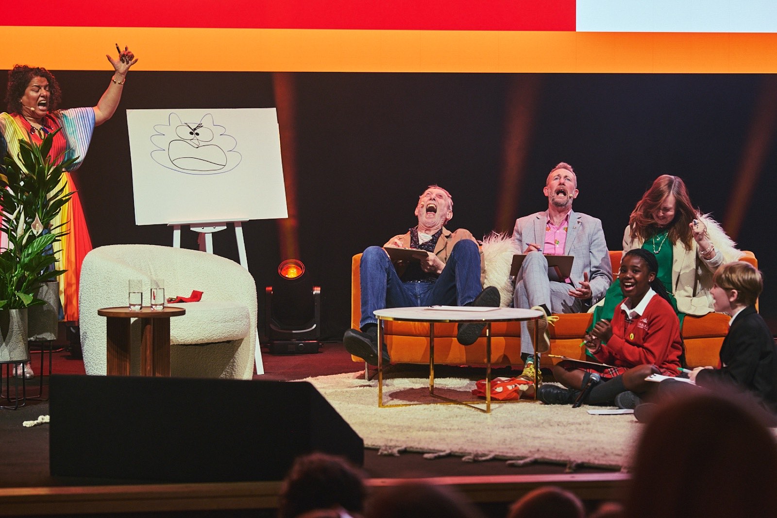 A family show on stage at Penguin Presents, with children and authors taking part